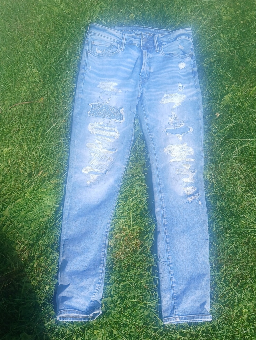 AEO  Airflex 360 Slim Patched Light Blue Distressed Jeans